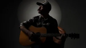 Adam Jones with microphone dim