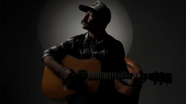 Adam Jones with microphone dim