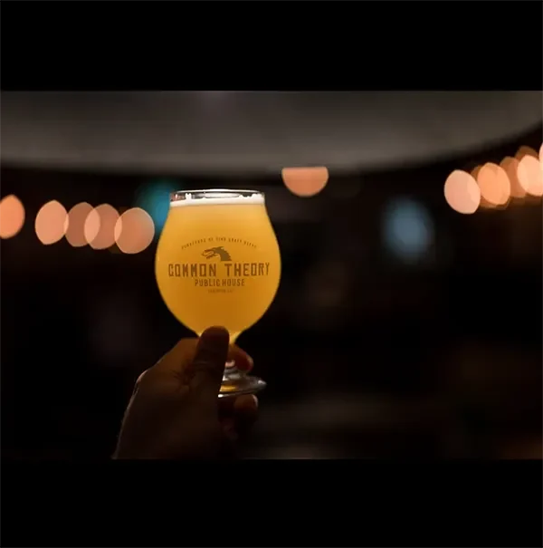 Common theory beer glass raised