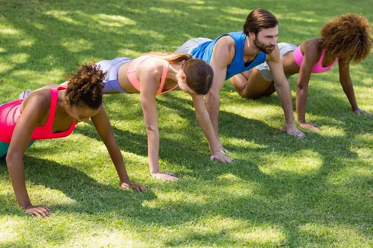 Group friends doing push ups