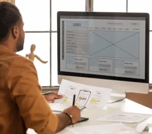 Man designing logos on pc