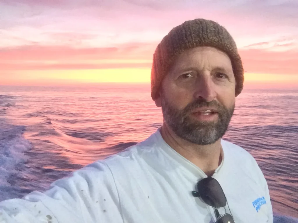 Mark beanie on ocean