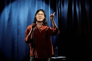 Young asian woman with microphone